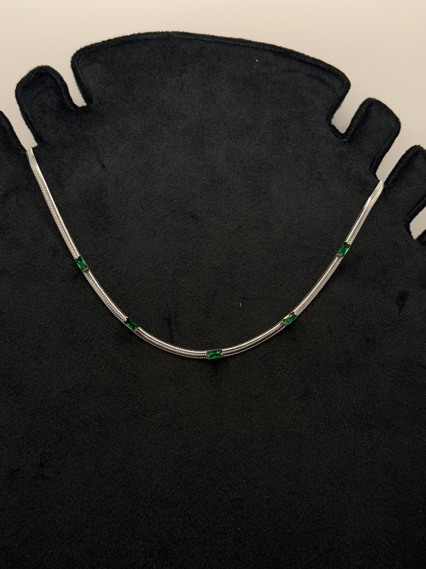 Elegant Silver Tone Snake Chain Necklace with Emerald Green Baguette Accents