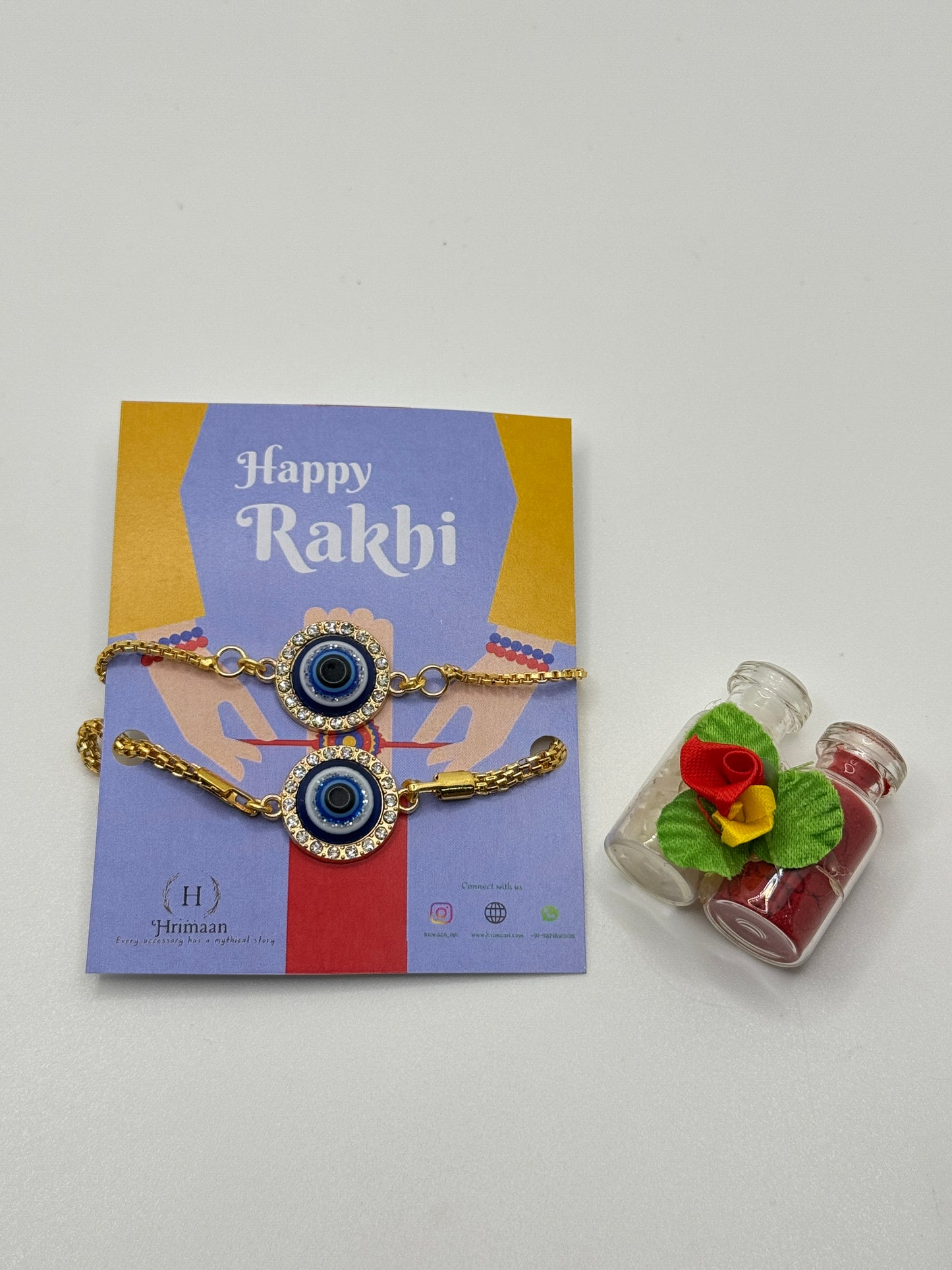 Evil Eye Duo Charm Rakhi for Bhaiya bhabhi  with kumkum and rice– Gold-Toned Protection Set