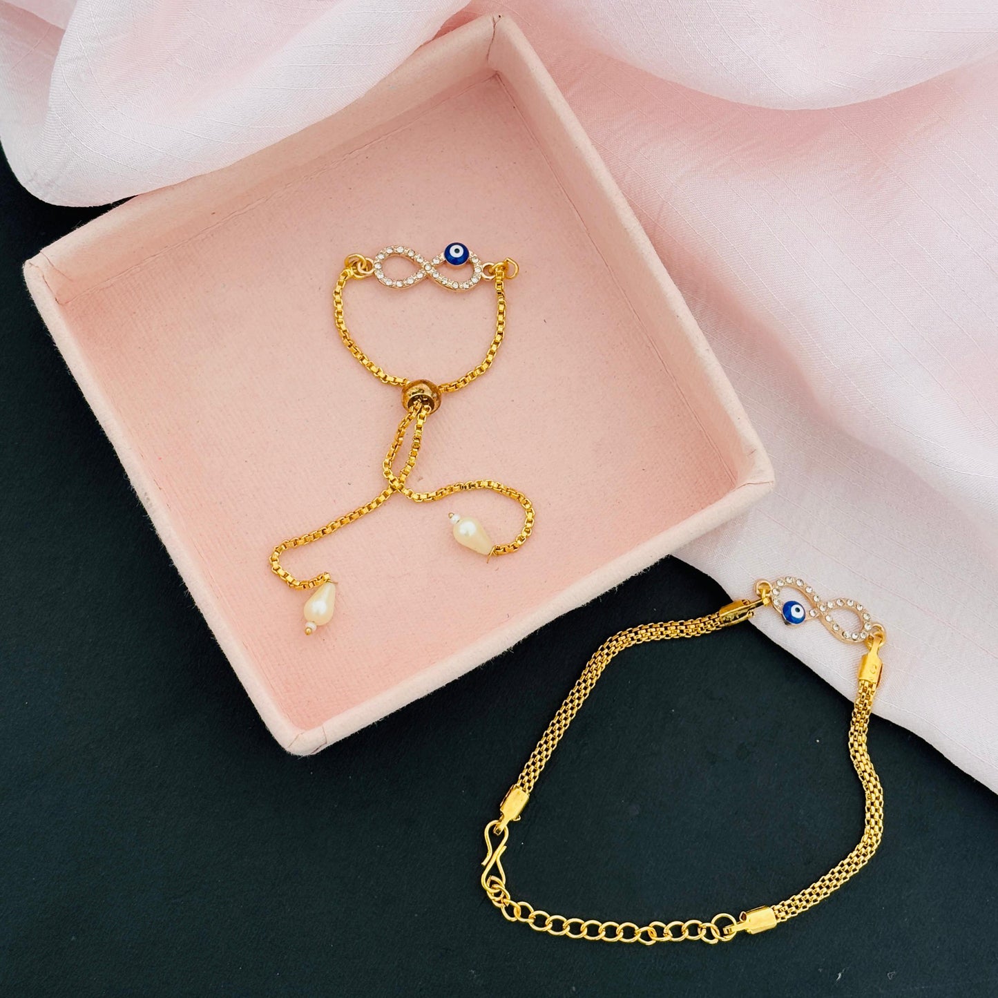 Evil Eye Duo Charm Rakhi for Bhaiya bhabhi  with kumkum and rice– Gold-Toned Protection Set