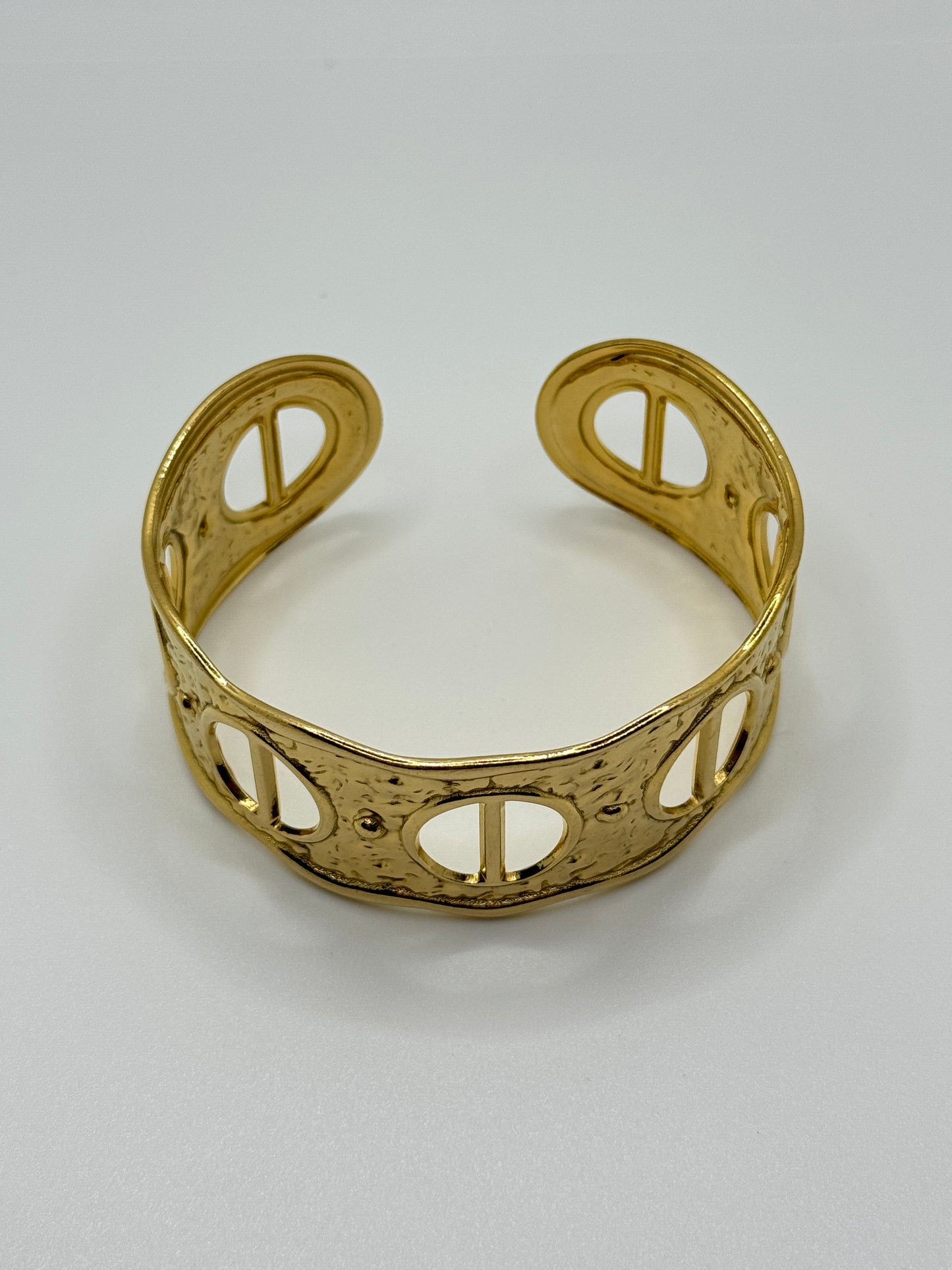 Ornate Gold Cuff Bracelet with Circular Cut-Outs