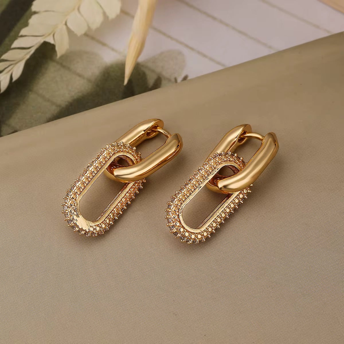 A stylish pair of chunky two interlocking chain earrings
