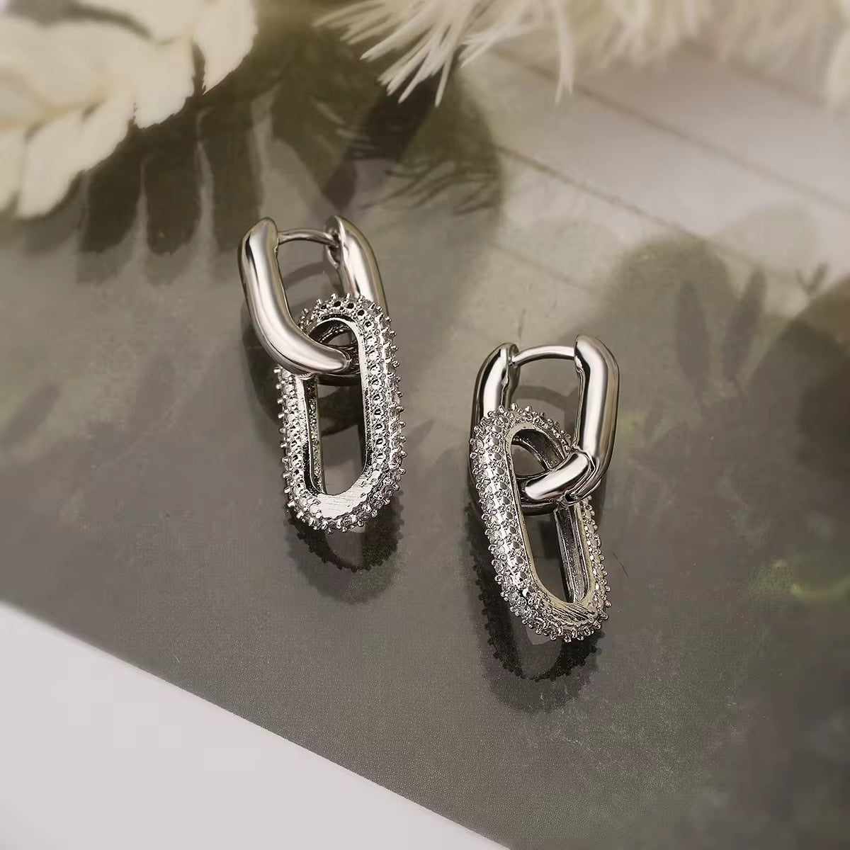 A stylish pair of chunky two interlocking chain earrings